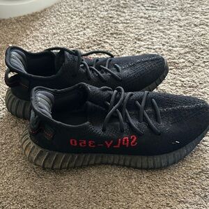 Black Yeezy sneakers authentic.